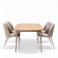 Wood dining table with upholstered chairs in beige fabric suitable for home use